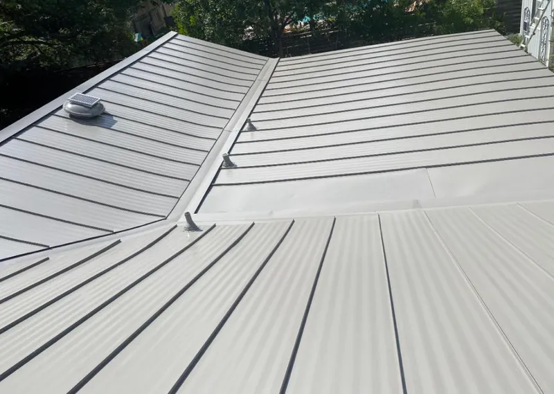 Solar attic fan installed on a metal roof for Roof Ventilation in Montebello